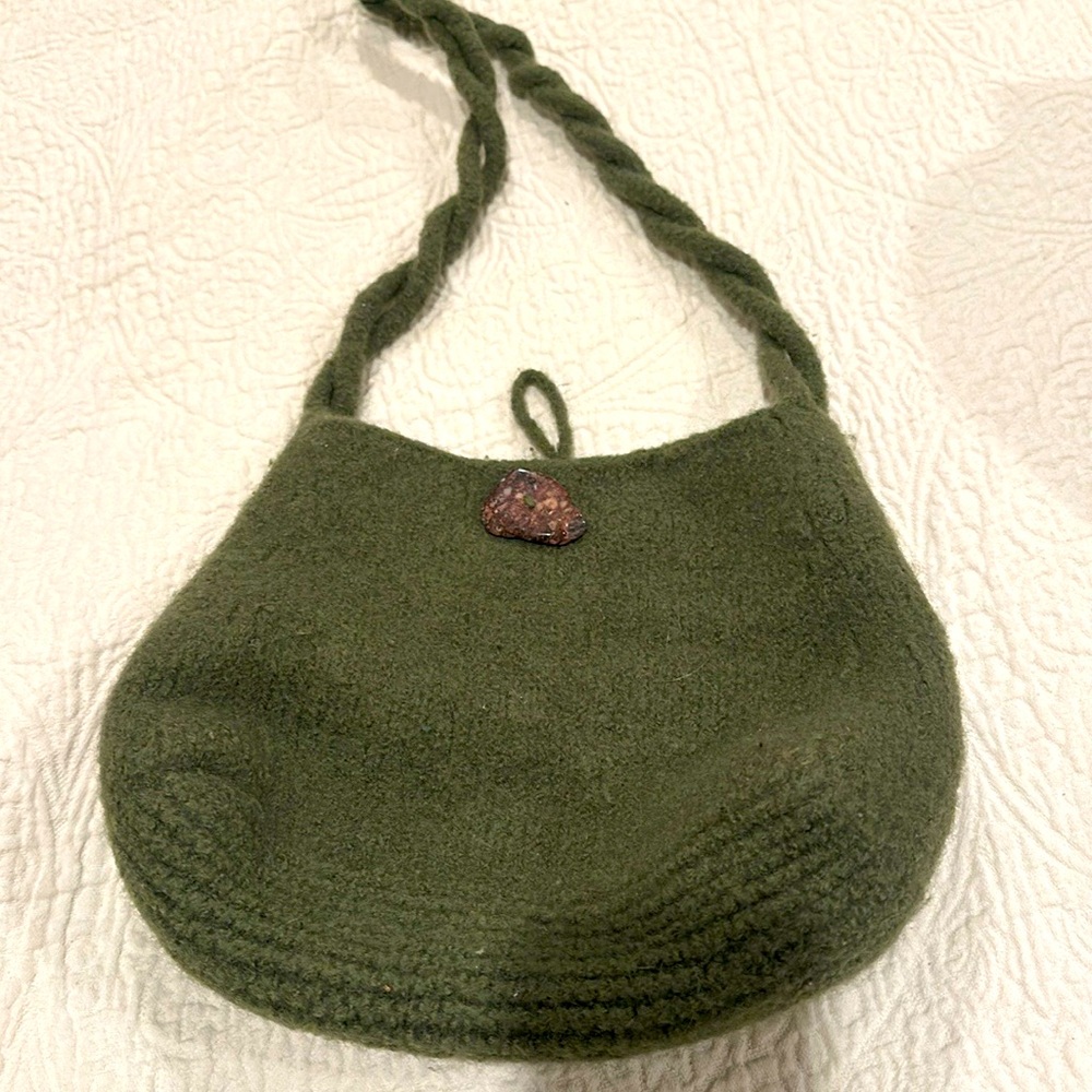 Hand knit green purse. 8 inch top and 12 inch bottom.